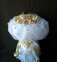 Chocolate bouquet of 16 Ferrero chocolates packed in white net with beads