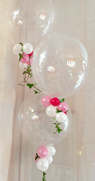 3 Transparent Bubble Balloons with small pink white red balloons trailing on the balloon stick