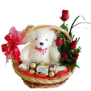 6 Red roses with 16 Ferrero and teddy in same basket