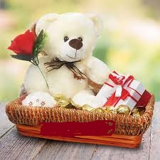 Teddy bear(6 inches) with 1 red rose and 2 dairy milk chocolate bars in same basket