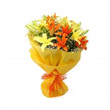 Yellow and orange Lilies bouquet with yellow wrapping paper