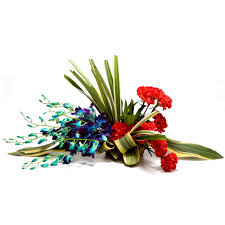 6 Blue orchids with 6 Red canations in a Basket