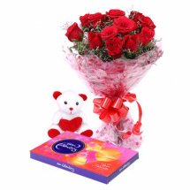 A dozen red roses with Teddy and a Celebration Pack