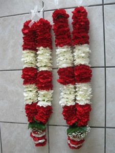 Traditional wedding garlands in jasmine flowers and red roses